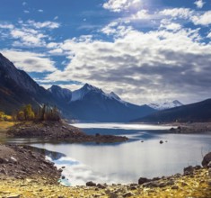 Canada, Alberta, Jasper Park. Lake Medicine. Great autumn day. The sun illuminates the snow-capped