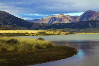 Huge lake with azure water, arid steppe of Patagonia and the steep slopes of cold mountains. Los