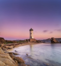 Long exposure view of the Punta Palau Lighthouse on the Emerald Coast of Sardinia at sunrise