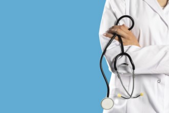 Lady doctor with arms folded and a stethoscope around her neck