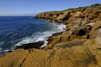 Rocky coast on the Atlantic Ocean between Burgau and Luz, Algarve, Portugal