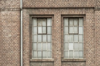 Details of an old industrial building, brick wall and windows, approx. 100 years old