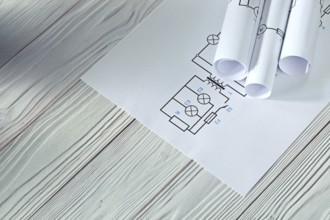 Electrical blueprints on vintage white wood