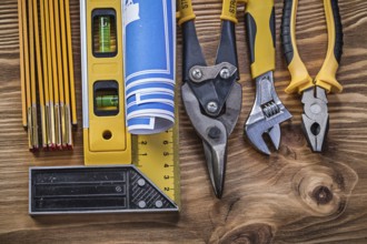 Variation of construction tools on vintage wooden board