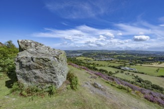 View from the mountains to Conwy Castle, medieval castle ruins surrounded by green fields and blue
