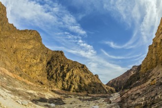 Picturesque and multi-color Black canyon in ancient Eilat mountains. Israeli warm winter. Photo