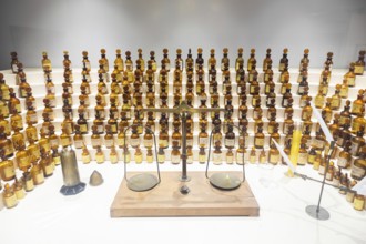 Grasse, France, August 2022: collection of ancient perfumes in laboratory with vintage balance