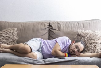Gay guy sleeping on sofa
