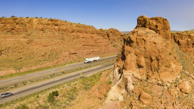 Vehilces Travel along close to the Laguna Pueblo along highway 40 in the desert southwest