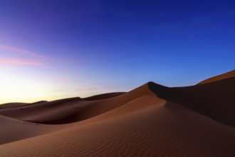 A view of the sand dunes at Erg Chebbi in Morocco at sunset
