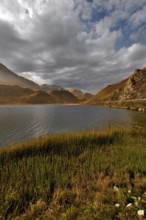 Autumn clouds over mountain lake