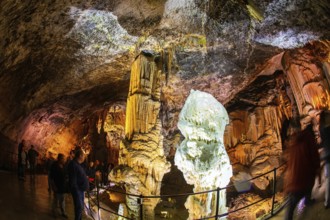 Colossal system of caves in Slovenia. Postojna Cave. Limestone plateau. Fantastically lit