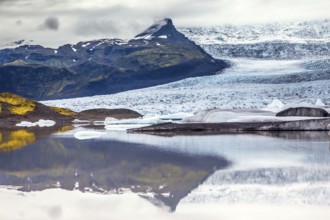 Glacier meltwater form a picturesque lake. The sunset over the Iceland's largest glacier