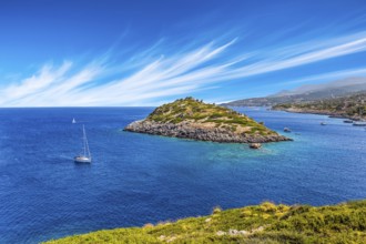 Holiday in Greece, island of Zakynthos. Bright blue sea water reflects coastal cliffs. Snow-white