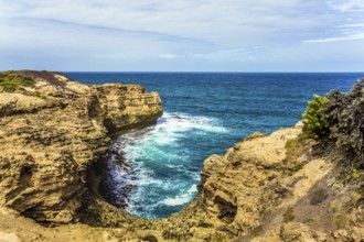 The Great Ocean Road of Australia. Picturesque ocean bay with clear green water. The coastal cliffs