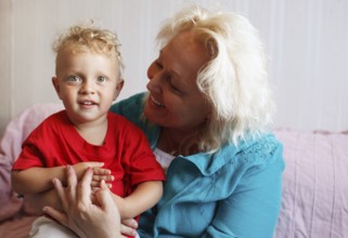 Happy grandmother with her little grandson