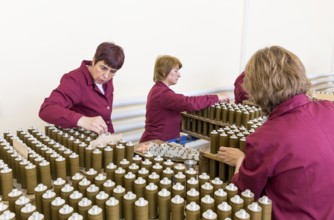 Sopot, Bulgaria - May 17, 2016: Female workers are checking explosive elements of anti tank