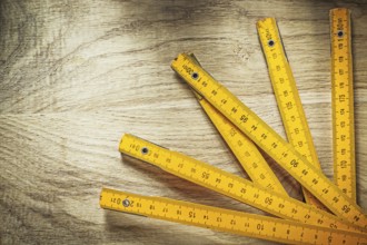 Wooden meter on wood board construction concept