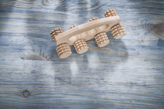 Wooden massager on wood board healthcare concept