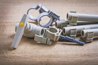 Water Valve Polypropylene Fixators And Pipe With Clips On Wooden Board