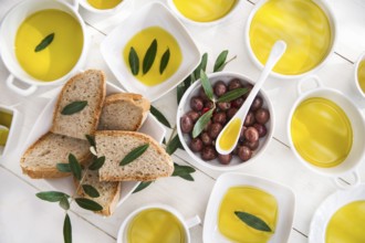 Presentation of wholemeal bread and olives with olive oil