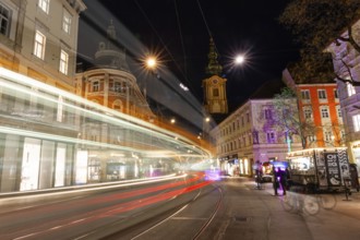 Light traces of a tram in Herrengasse, night shot, Graz, Styria, Austria