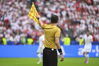 Assistant of football referee during the match
