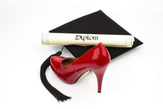 A red woman's shoe on a doctor's hat, symbolic photo for equal rights and woman's power Austria