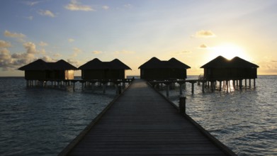 Water bungalows at sunset, Kandoludu, Maldives Maldives