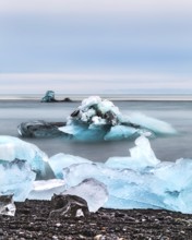 Blue icebergs and chunks floating in a calm ocean scene, iceberg Iceland, glacier, snow, ice rock,