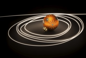 An image of an orange christmas ball with light streaks