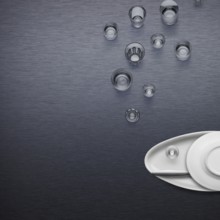 Creative dishware concept, figure of a fish blowing bubbles made of plates and glasses
