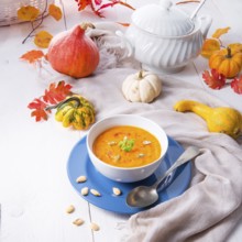 Healthy pumpkin soup with ginger carrots and coconut milk