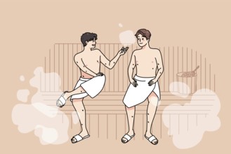 Happy male friends in towels relax in sauna on weekend together. Smiling men enjoy bathhouse