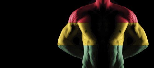 Ghana flag on muscled male torso with abs, black background