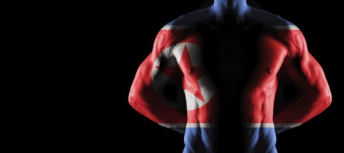 North Korea flag on muscled male torso with abs, black background