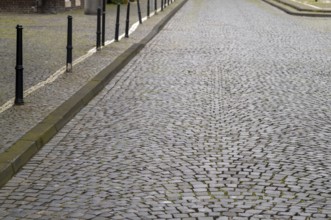 Old cobbled street with pavement in germany