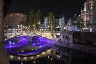 Famous three bridges at the Preseren square in the center of Ljubljana colorfully illuminated at