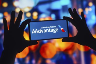 In this photo illustration, the AAdvantage American Airlines logo is displayed on a smartphone