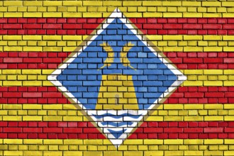 Flag of Formentera painted on brick wall