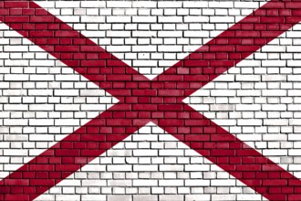 Flag of Alabama painted on brick wall