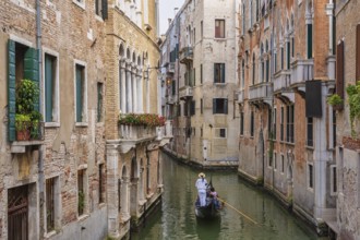 Venice Italy, city skyline at canal in Venice with Gondola boat