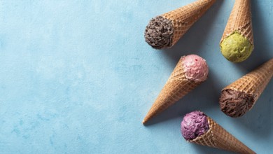 Various ice cream scoops in cones with copy space. Colorful ice cream in cones chocolate,