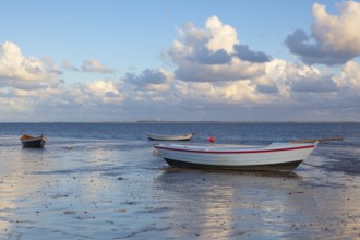 Fishing boats on the empty beach, Hjerting, Jutland, Denmark. Hjerting is a district of Esbjerg in