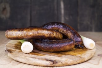 Fried Sausages On a Wooden Board