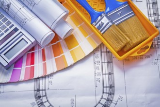 Paintbrushes paint can blueprints calculator color palette construction concept