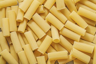 Short-cut raw pasta background food and drink concept