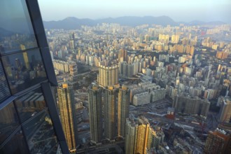 Hong Kong aerial view from the hundredth floor of a skyscraper at sunset
