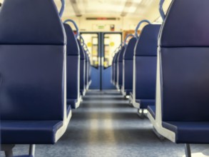 An empty train car with new blue leather seats