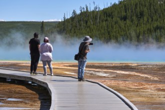 Tourists On Grand Prismatic Spring In Yellowstone National Park, Wyoming, USA, USA